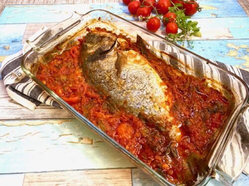 Orata con pomodoro e fiori di zucca